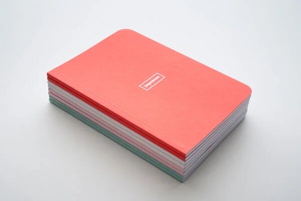 Cuadernos grapados, cosidos con hilo o fresados con lomo.